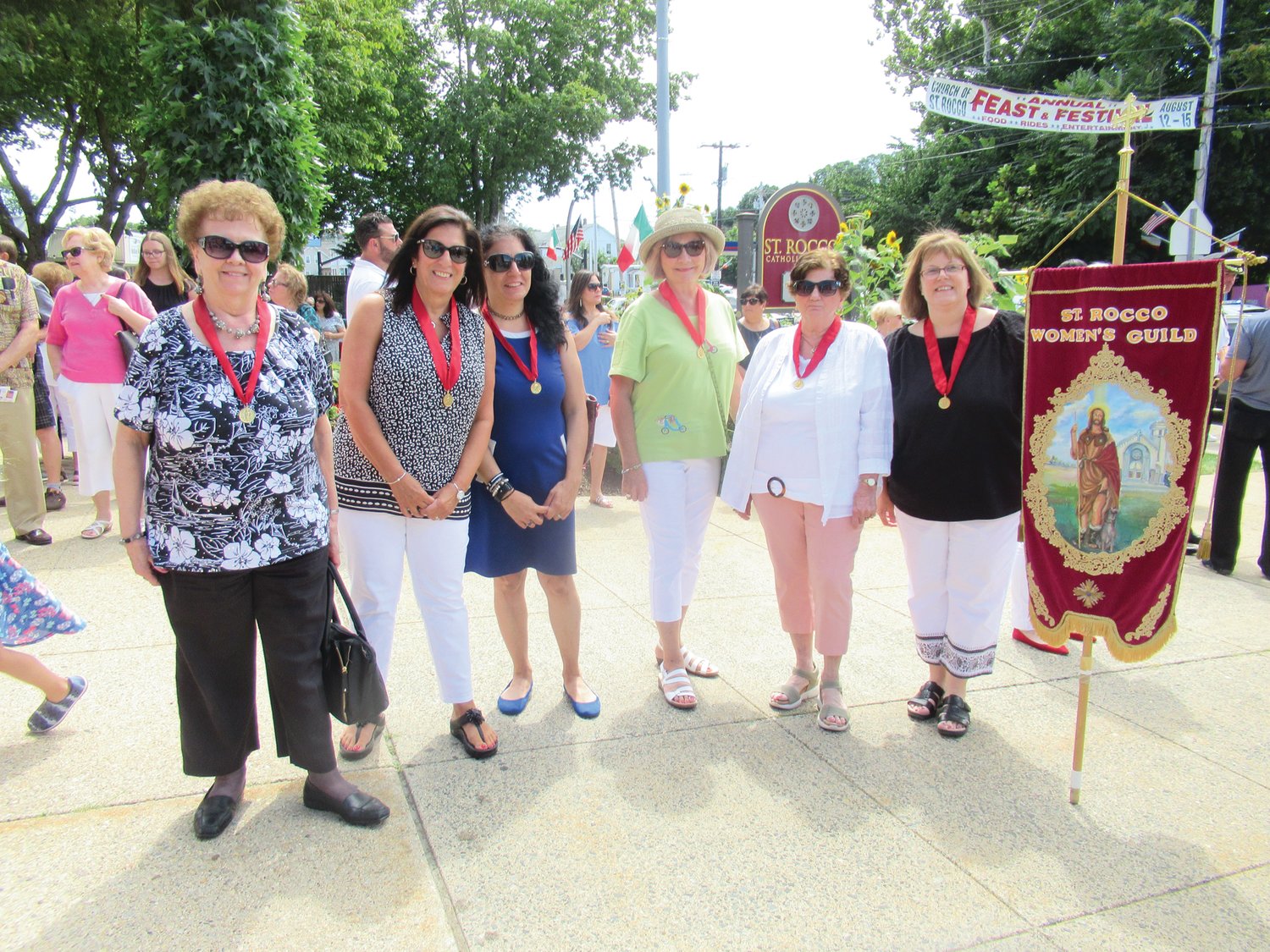VALUABLE VOLUNTEERS: These members of the Saint Rocco’s women’s Guild worked tirelessly for four days and even marched in Sunday’s annual Feast Mass procession.